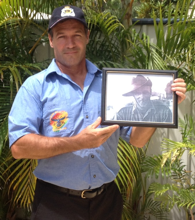 William Brown RSL Secretary Darren Davies holding a frame with his Great-Grandfather William Brown