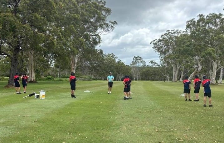 The students received some tips from golf pro James.