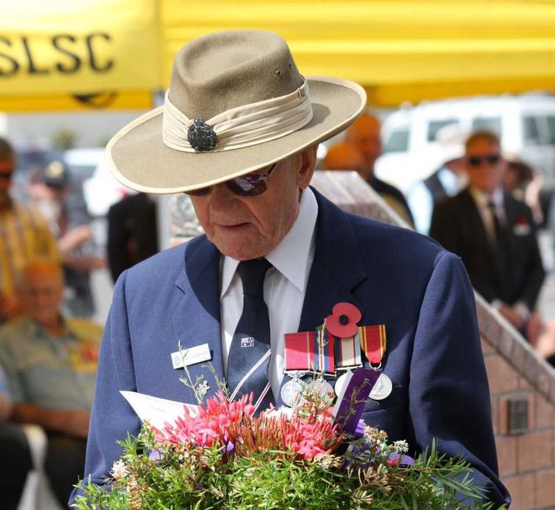 Ray Parker lays a wreath at the Rainbow Beach Cenotaph last year