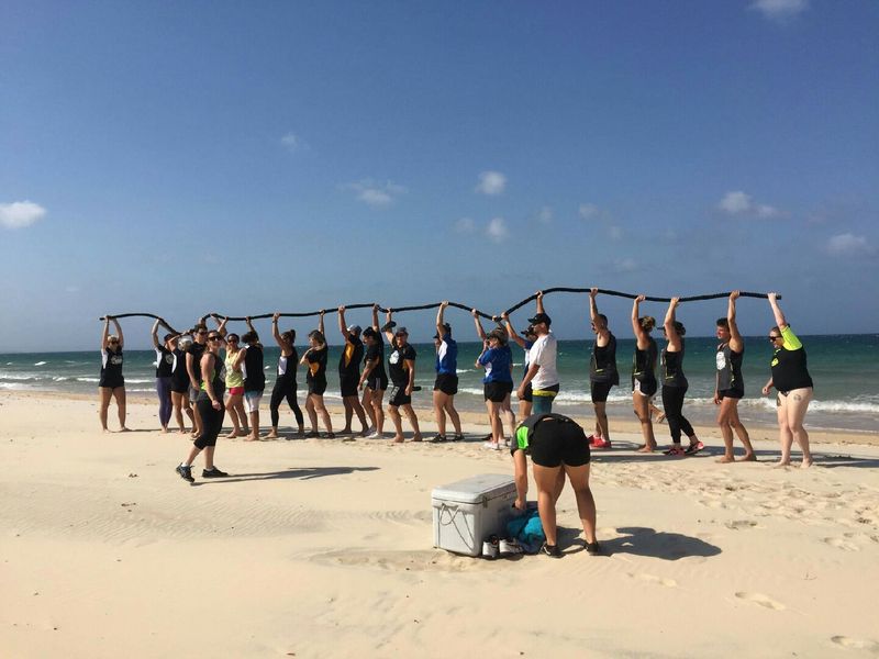 Teams doing a rotation run as a warm up in the Battle of the Business Challenge