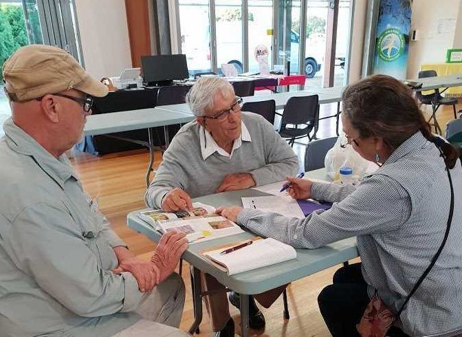 Dr Don Sands (centre) will be back in Rainbow Beach for a public presentation on October 6