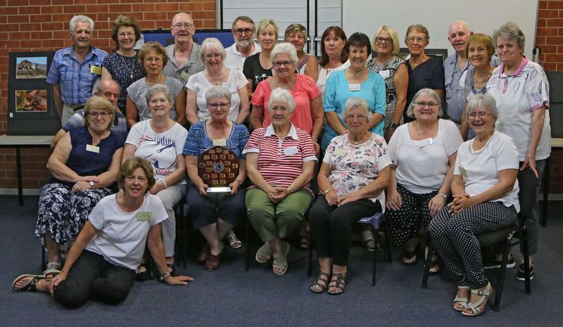 Tin Can Bay Camera Club members celebrate winning the Tewantin-Noosa Shield