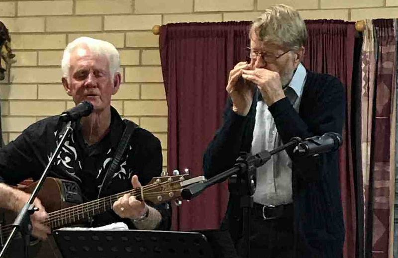 Ron on guitar and Len on harmonica at a Music Plus event pre Covid