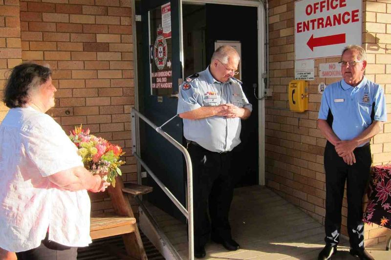 Lillian Clark with Assistant Commissioner Professor Stephen Gough and Gary Langford QLAC representative, thanking Lillian for