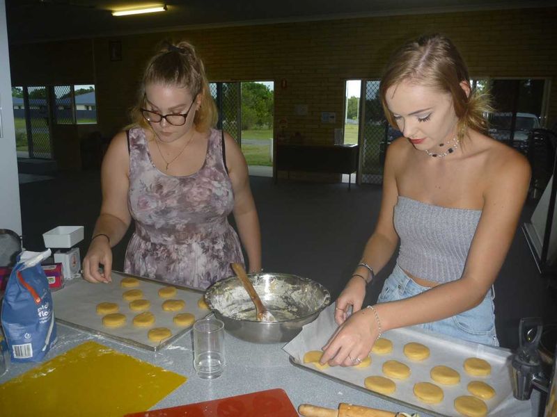 CCYAP - Shervawn Wilson and Britney Rose cutting cookies