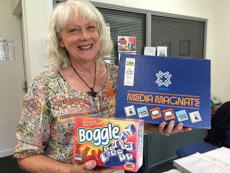 Coralie Leslie from Community Information and Resource Centre shows some of the games for hire