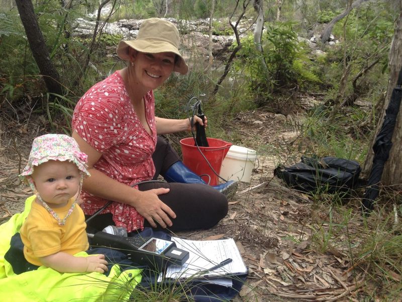 Bonnie assists mum, Jess Milne, take a water sample reading at Snapper Creek for Cooloola Coastcare
