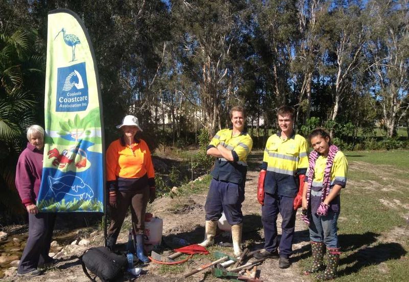 Cooloola Cove resident Chris Housten (left) is happy with the new drain design on the reserve behind her house. Helping to pl