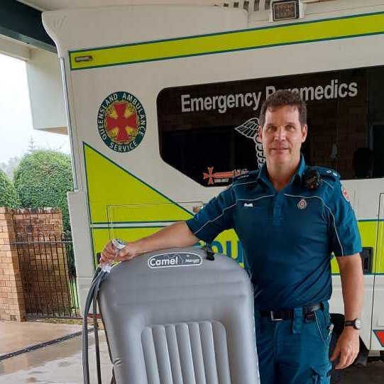 Jeff Munro (A/OIC Cooloola Coast at the time) demonstrating the Camel Chair purchased with funds raised by CCLAC