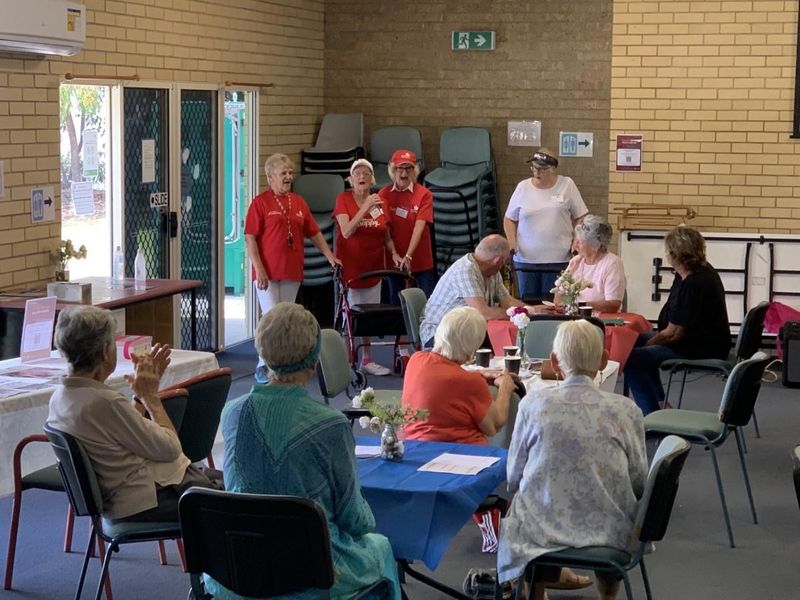 Joan Barnier, Judy Kiddle, Maggie Travers, and Barbara McKenzie singing "Our Wheelies up in front!" at the Cuppa in Cooloola