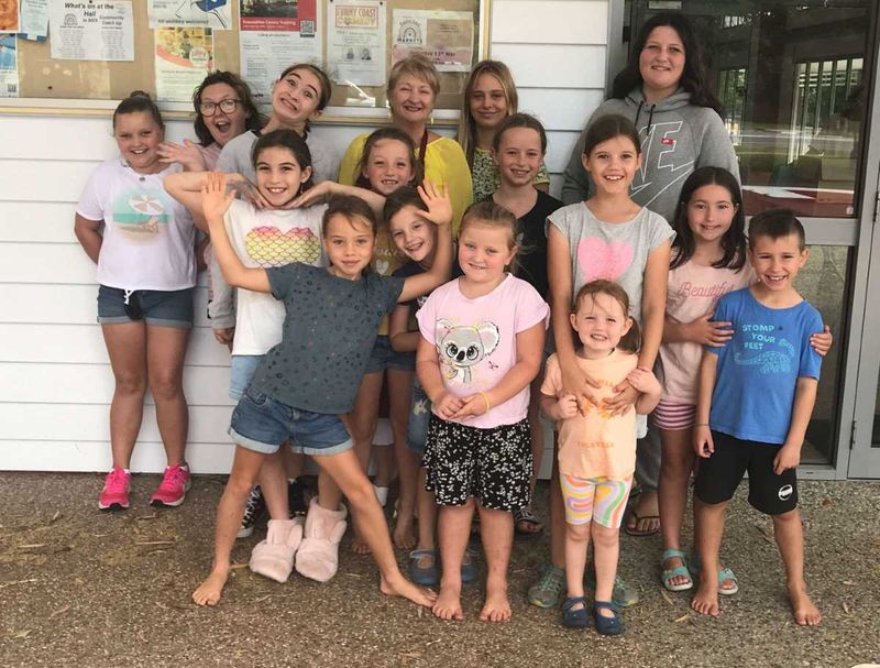 Gabriella with children from the Rainbow Beach Learning Community.