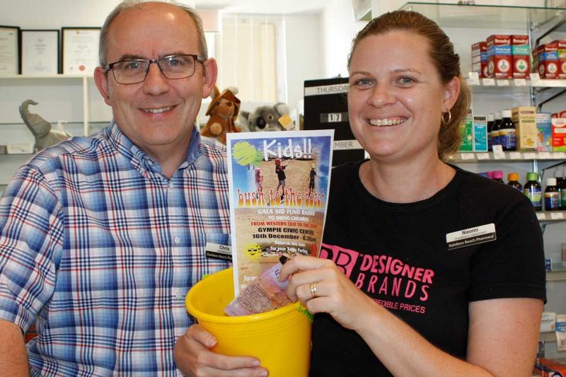 Rainbow Beach pharmacist, Chris, and assistant, Naomi Cole, say come in and buy your ticket for the Kids Bush to the Beach!