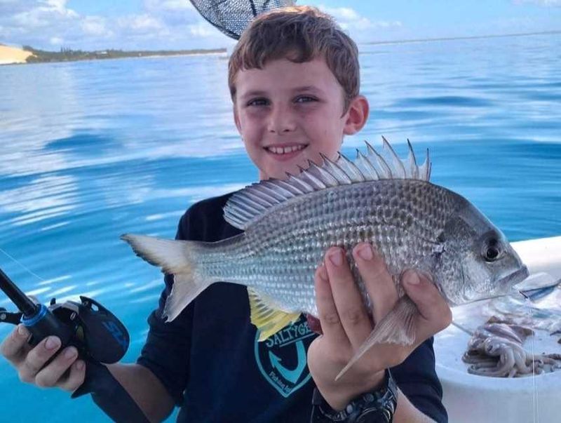 Tin Can Bay Fishing Club - Connor Lyell with a bream he caught