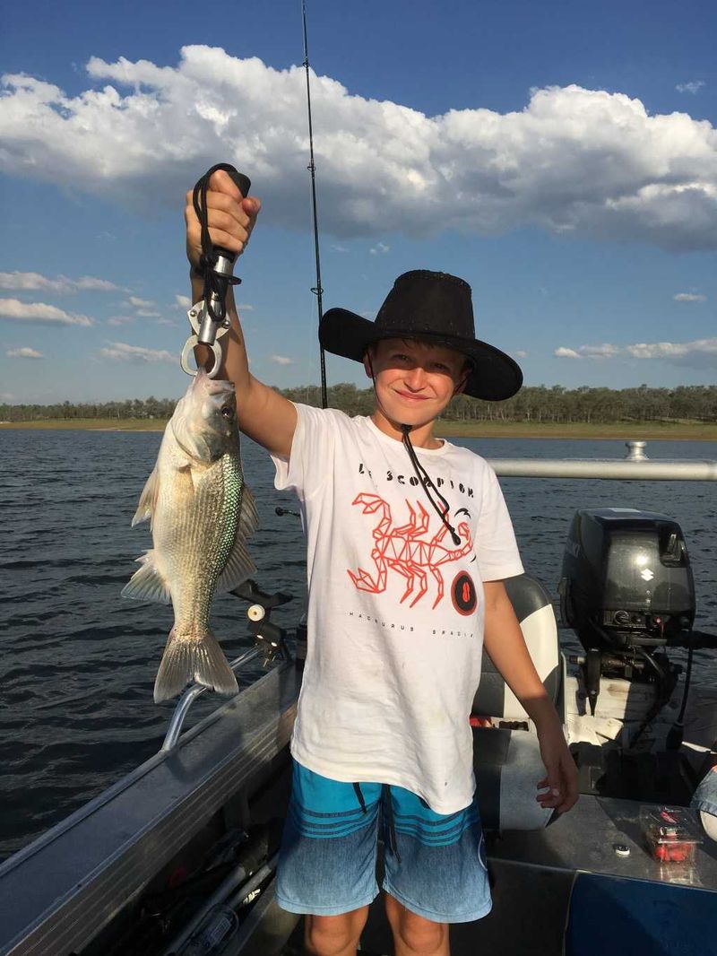 11-year-old, Thomas May, who caught this nice bass whilst on a club outing at Boondooma Dam recently