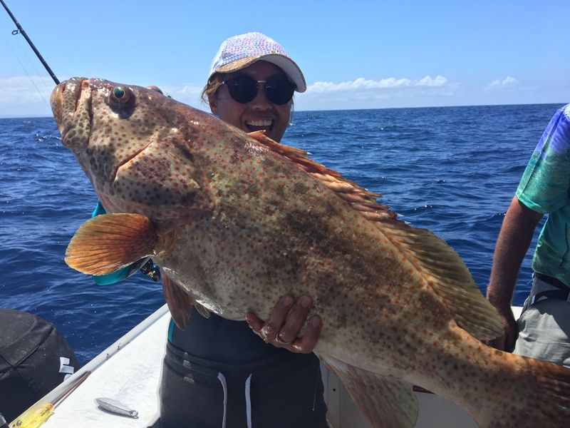 Julie with a nice cod to go with her mixed bag for the day on Rainbow Beach Fishing Charters