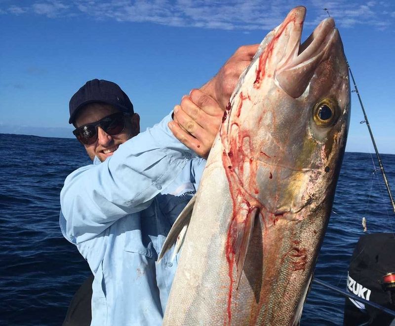 Matt with a personal best AJ on board Baitrunner with Mat