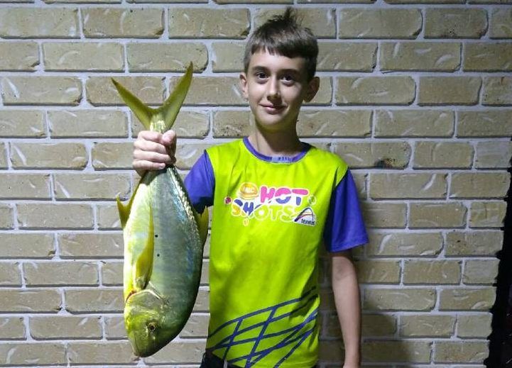 Caleb Jensen was absolutely thrilled with his new rod and he caught a GT off the Tin Can Bay jetty, weighing just over 2kg -
