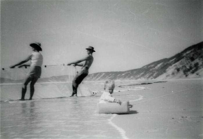 Net fishing on the beach with a young Tony Dean in the foreground – 1960’s