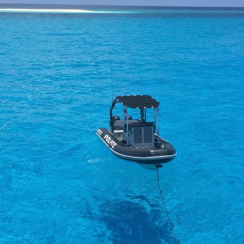 QPV Brett Irwin tender vessel tied behind the main vessel anchored at North Flinders Reef during a recent patrol. Water here