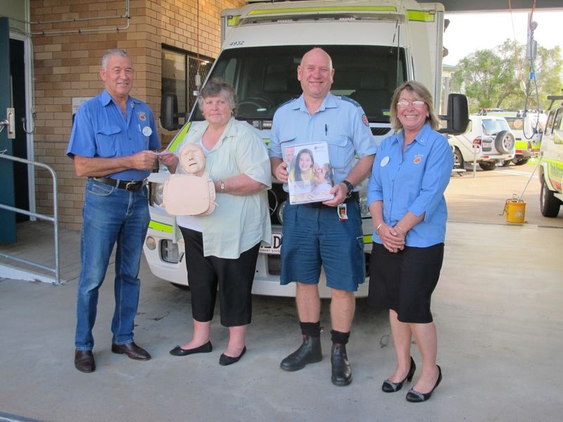 TCB Lions Philip Davey (President) and Rachel Fender (right) present a cheque to CCLAC President, Lillian Clark with one of t