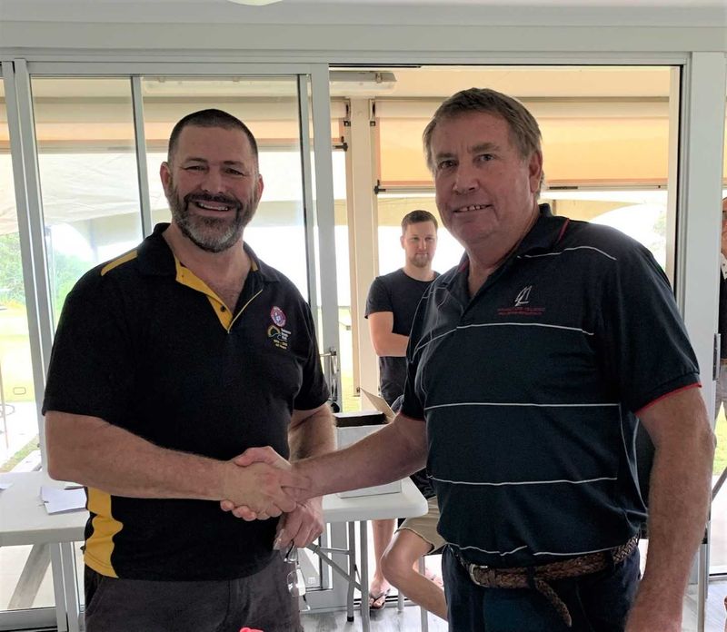 Shane Handy being congratulated by life member Kim McCarthy at the surf club AGM last month after receiving his Life Membersh