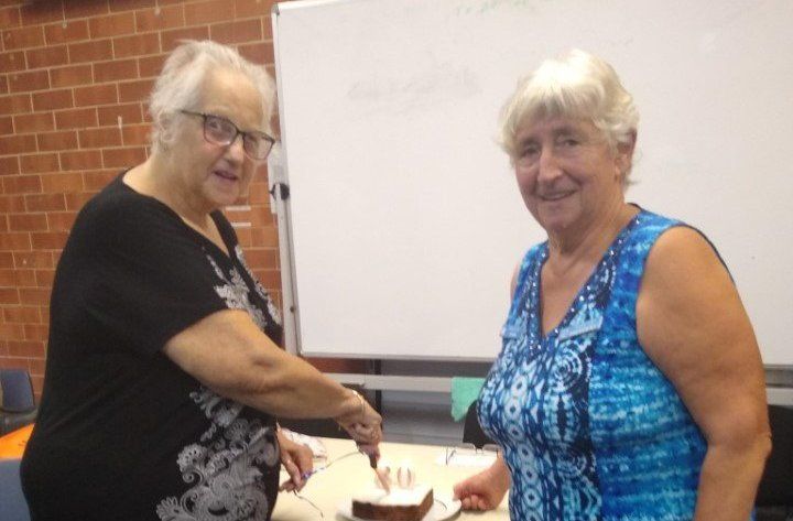 Probus president, Jo Said, with new member, Barbara McKenzie, cutting her 80th birthday cake