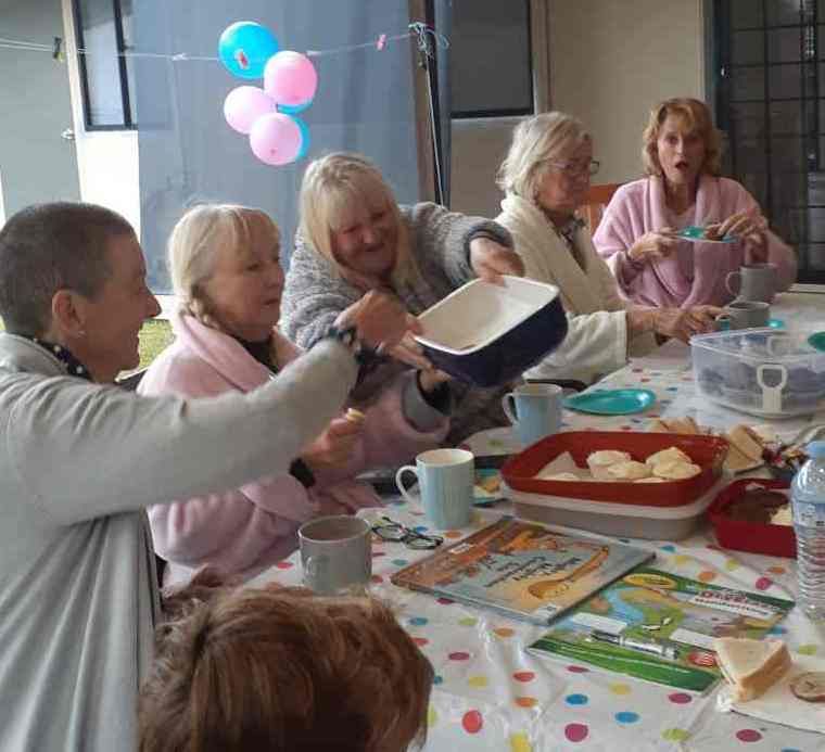 Mary-Anne, Denise, Kathy, Sue, and Cherie enjoying morning tea in their PJs. Sue won a prize from the raffle, kindly donated