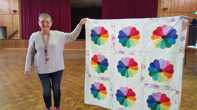 Linda Pottle with a Dresden Plate quilt