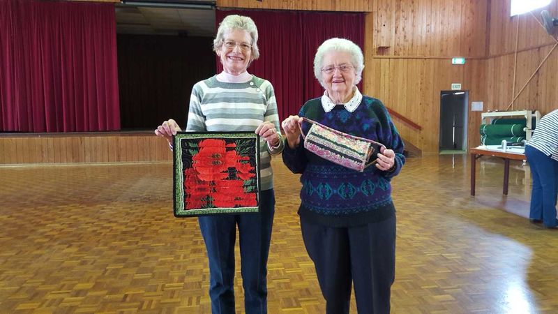 Tin Can Bay Quilters Coral Welham with a fractured quilt and Eunice Coombs with a utility bag