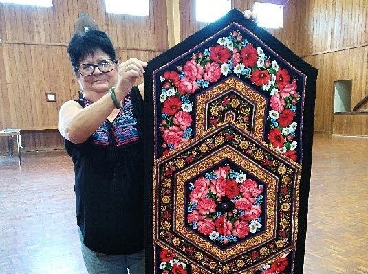 Leonie from the Tin Can Bay Quilting Club with her dazzling table runner
