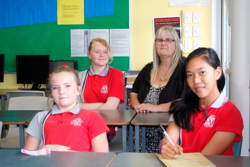 Girls with a purpose: Paris Delroy, Georgia Bogodoohoff, and Decemie Gabales with teacher, Robyn Cottrell