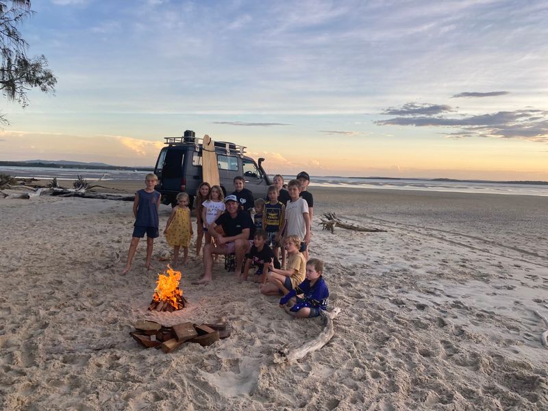 Josh Arnold and some of the RBSS song writers at just one of the beautiful destinations in the Reach for a Rainbow video