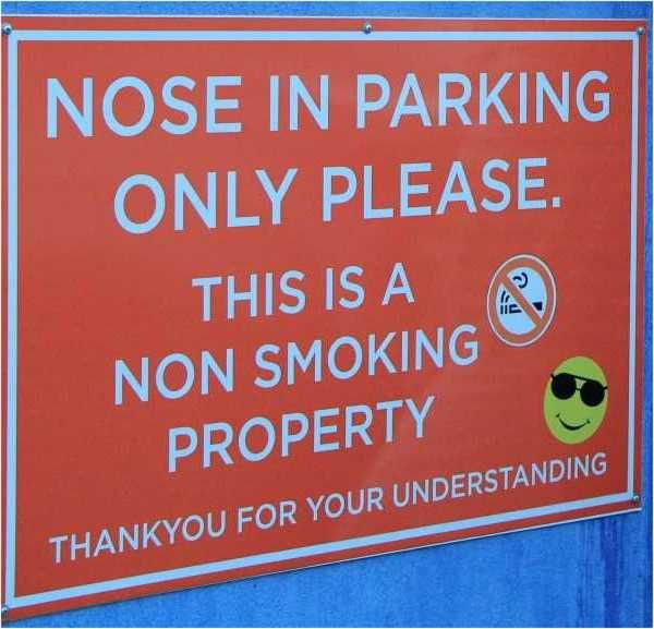 Signage outside the Top Shops in Rainbow Beach has decreased smoking at the venue, cigarette butt littering, and complaints f