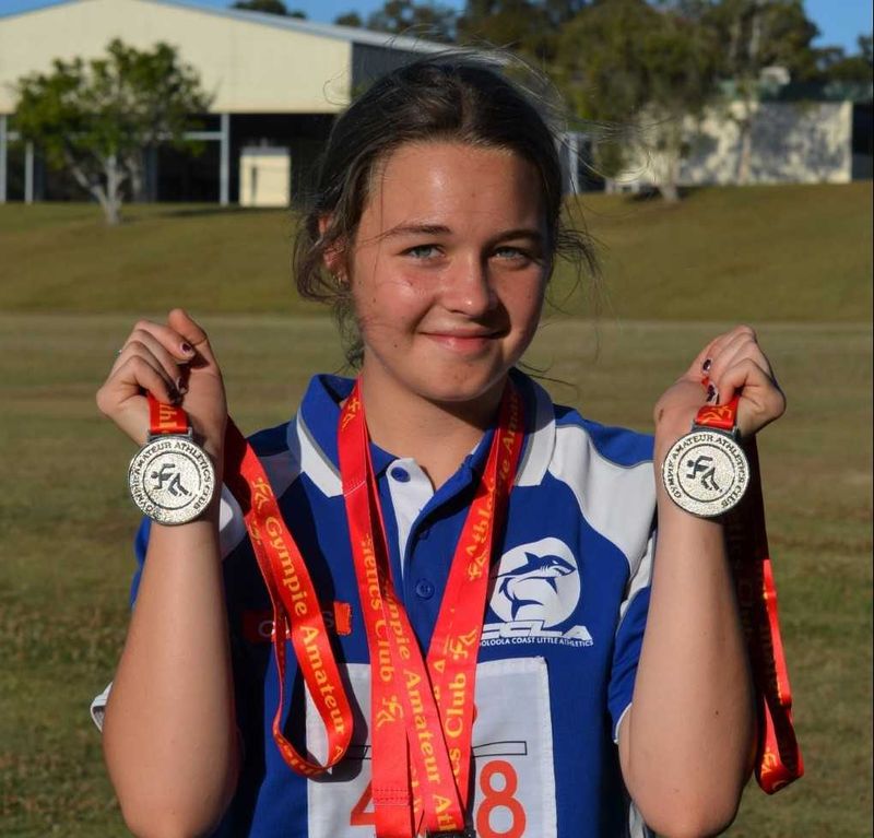 Anjelica Geurts with her haul of silver medals from the Gympie Athletics Spring Carnival