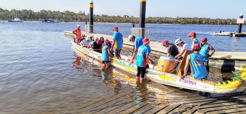 Placement of paddlers in the dragon boat to achieve good balance is crucial overseen by sweep Norma Sanderson.