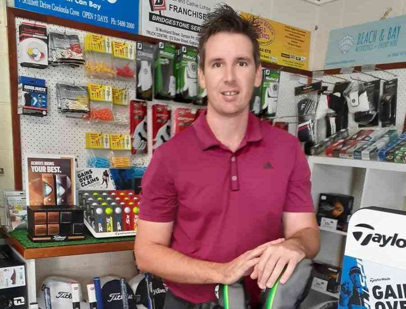 Professional Golfer James Taylor with new stock in the Pro Shop