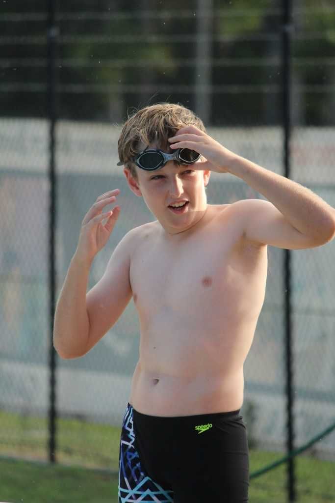 Swim club member, Zac lines up for his race