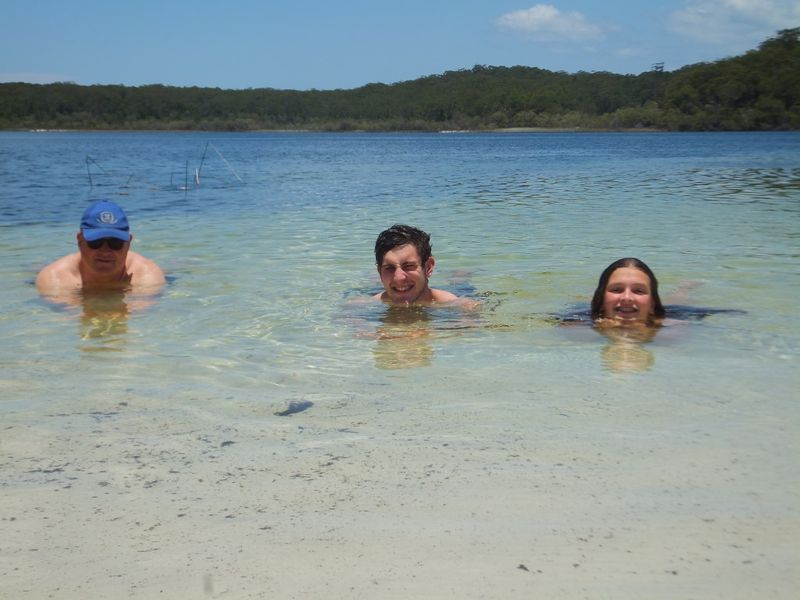 Miles, Matt and Ellie Boak swim in pristine Lake McKenzie on K'gari (Fraser Island): interest in Australia’s Nature Coast has