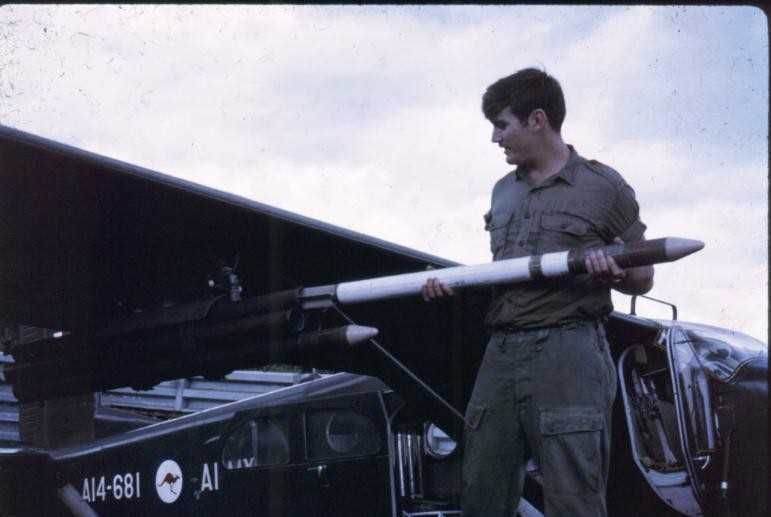 Local Veteran, Bob Carroll loading rockets in Vietnam