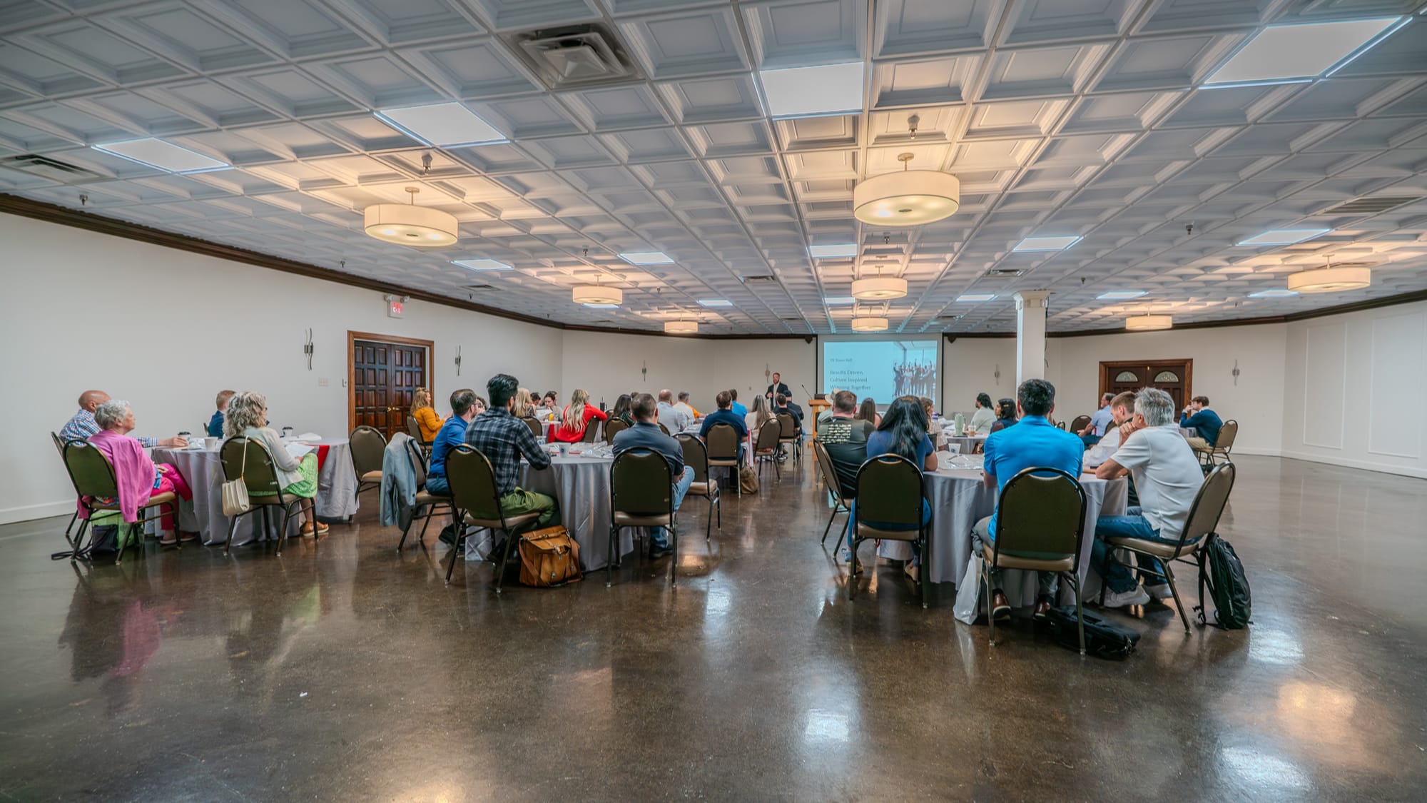Full room of Kings of Real Estate team members seated during the Town Hall presentation
