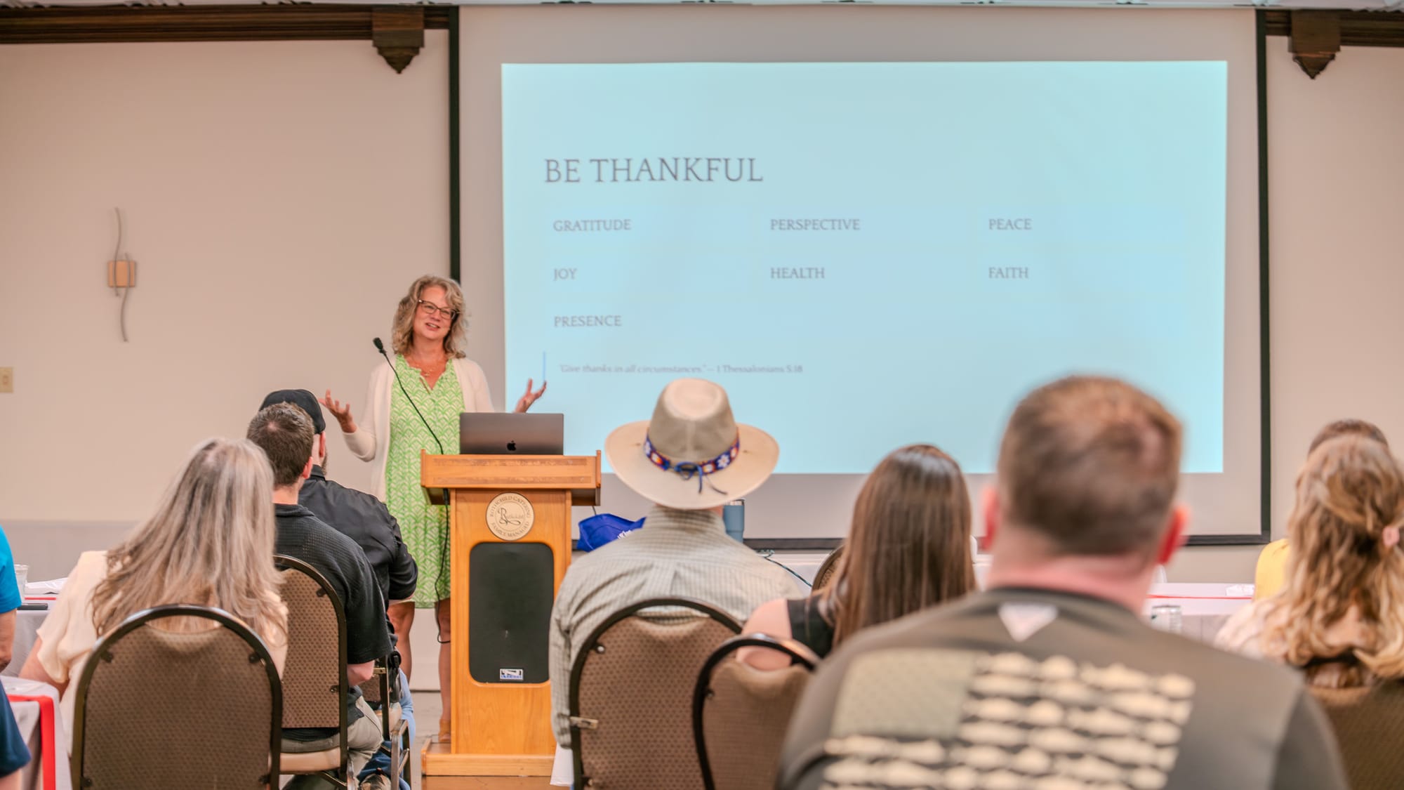 Team member presenting the Be Thankful segment at the Kings of Real Estate Town Hall