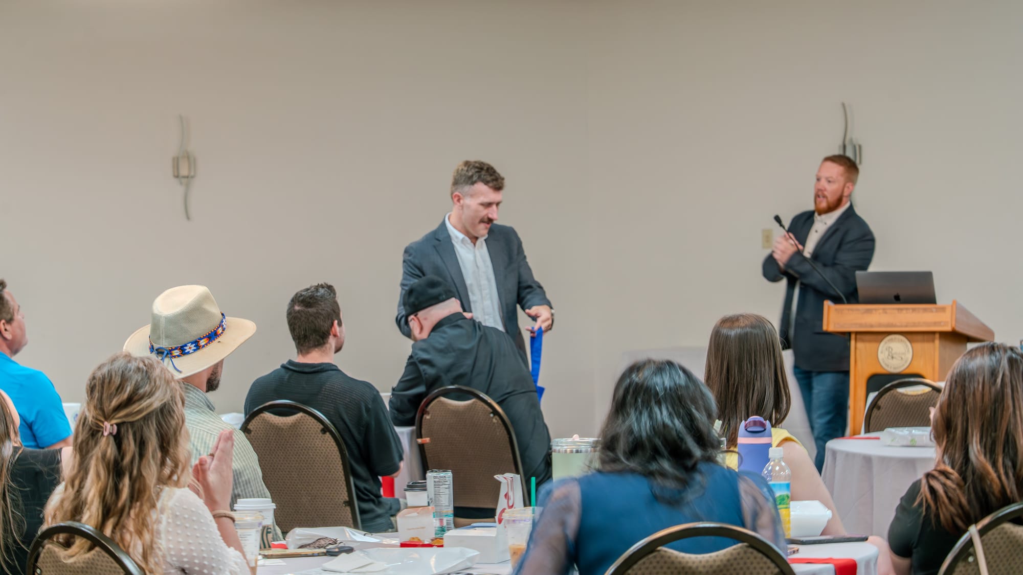 Team member being recognized during Cheers for Peers at Kings of Real Estate