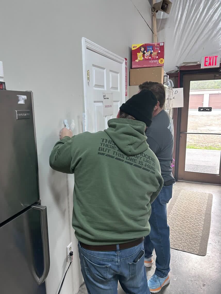 Volunteers patching walls at LIVE-IT Ministries
