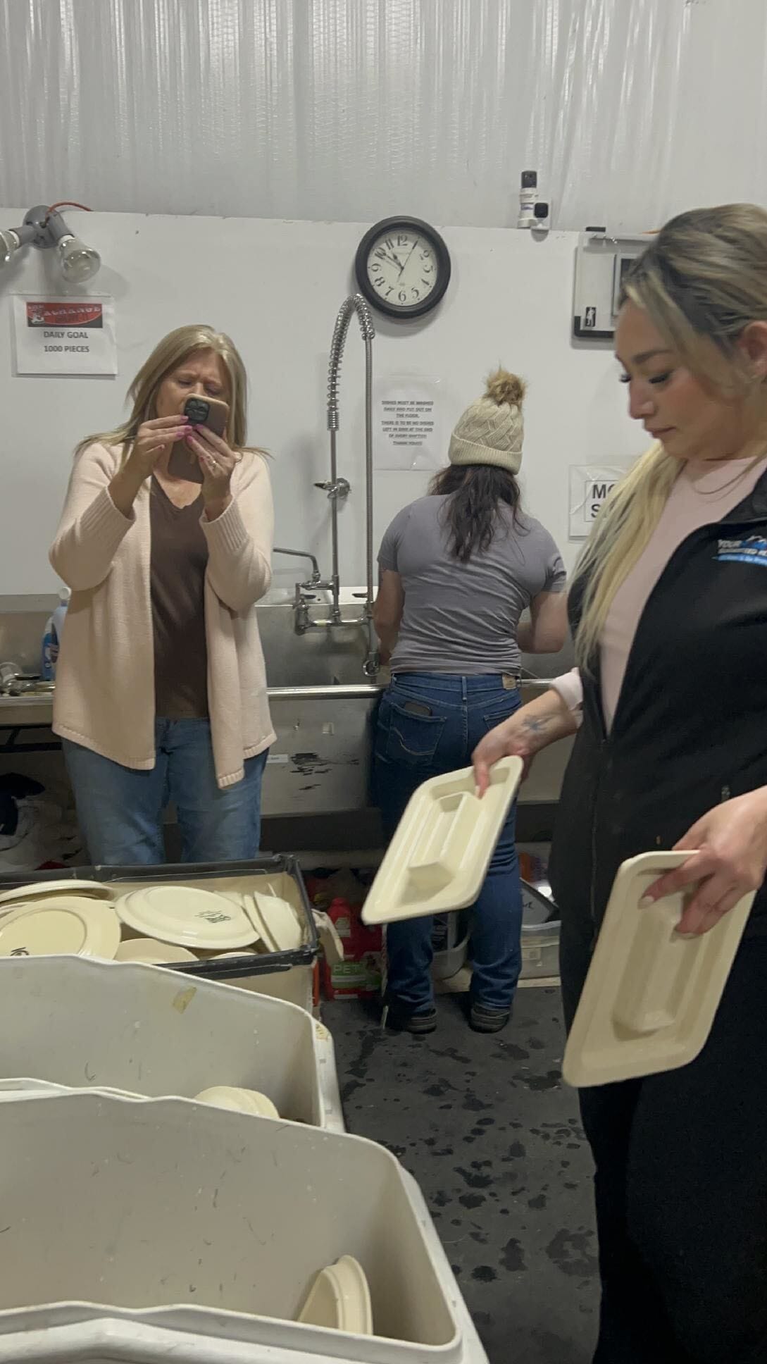 Volunteers washing dishes in the LIVE-IT Ministries kitchen