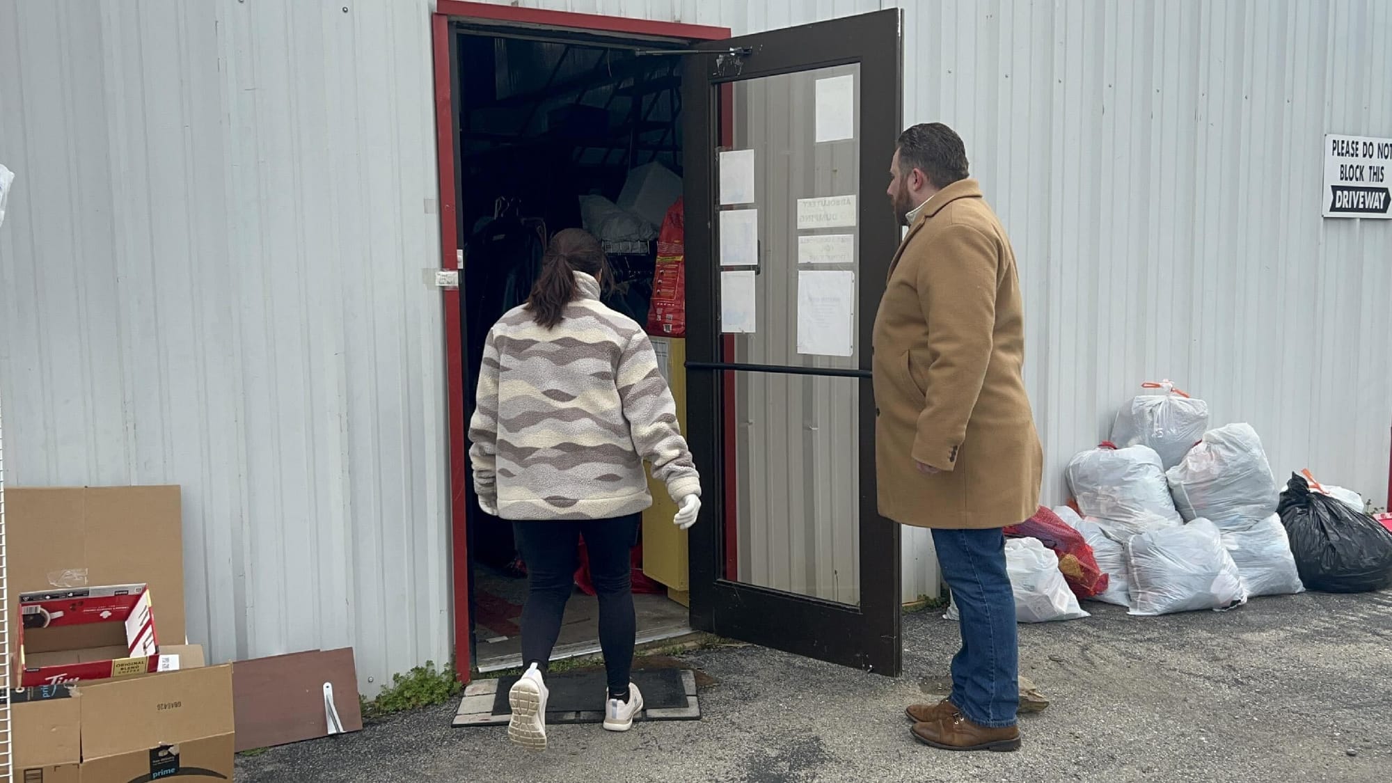 Team members filling the planter with fresh soil