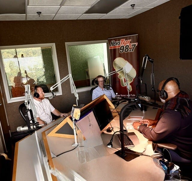 Tracy King and Tannor Giles recording live on NewsTalk 98.7 WOKI with host Hallerin Hilton Hill
