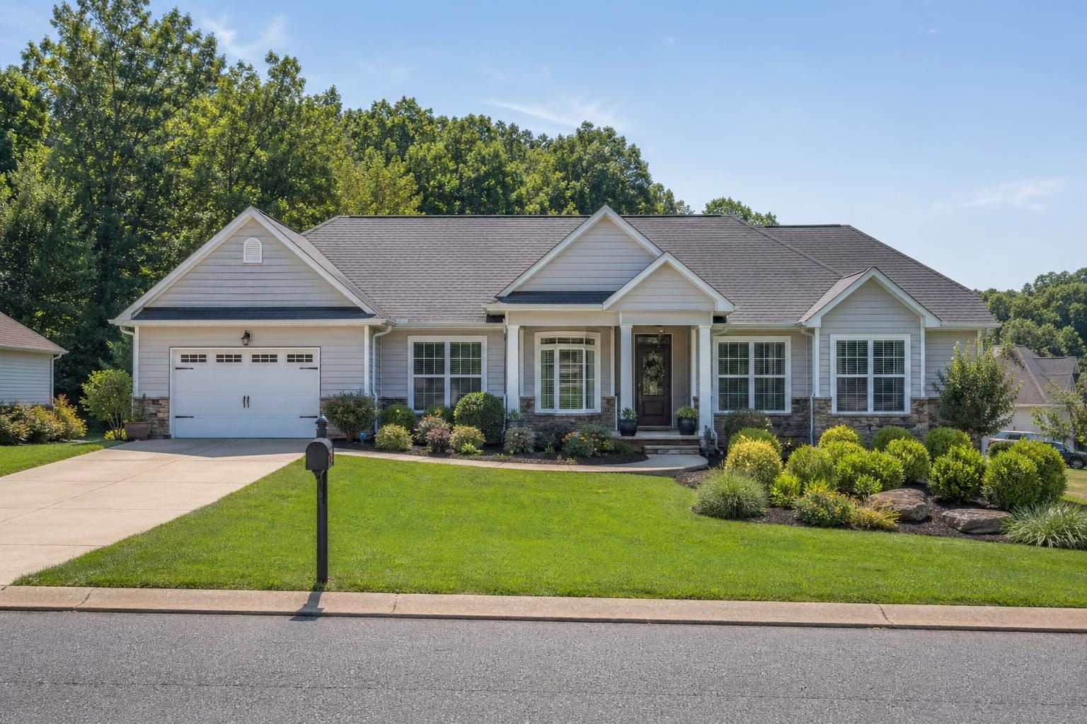 Manageable Powell Tennessee home with mature landscaping suited for downsizing sellers