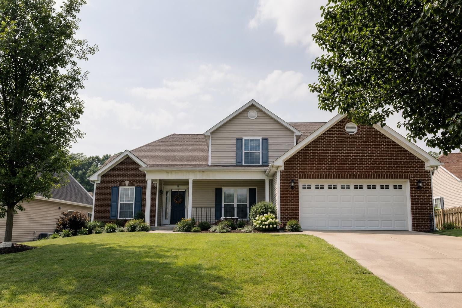 Well-kept Powell Tennessee suburban home with mature trees and seller-ready curb appeal