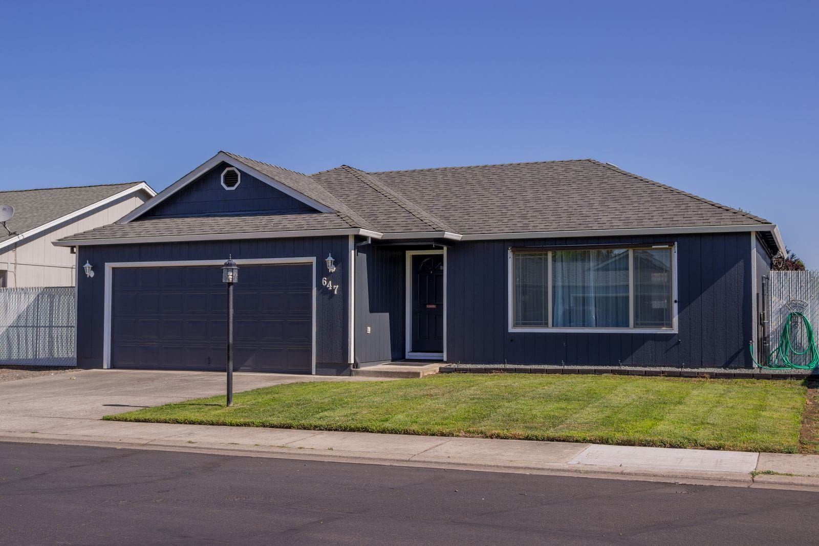 Photoreal Johnson City hillside home under clear sky, no people, logos, or text