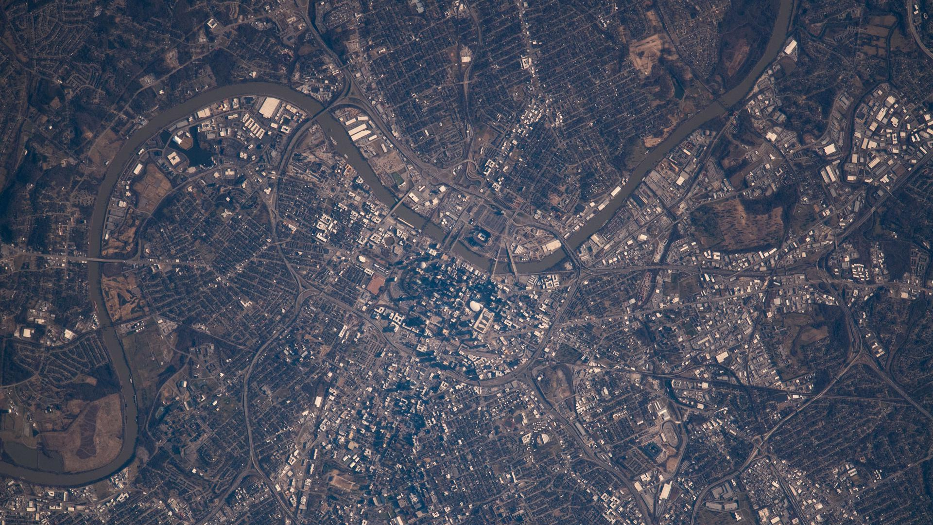 Photoreal Nashville skyline across the Cumberland River at blue hour, no people, logos, or text